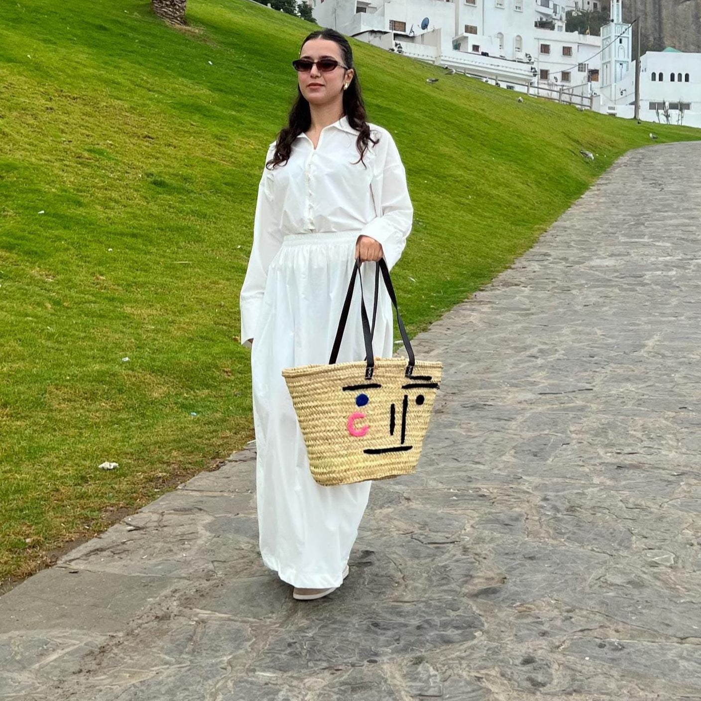Face Motif Woven Handbag